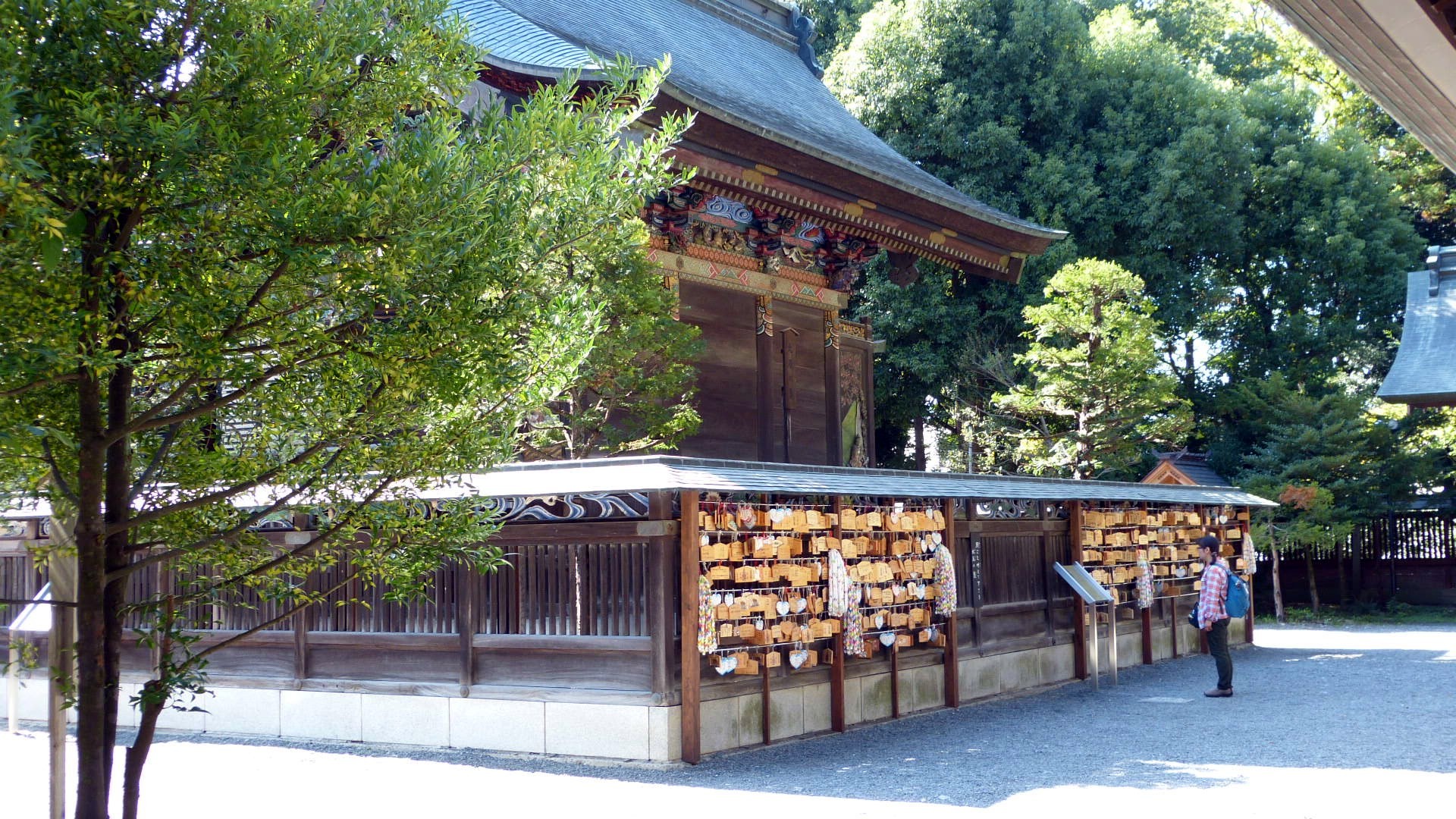 a side of the shrine where wooden prayer plaques are tied